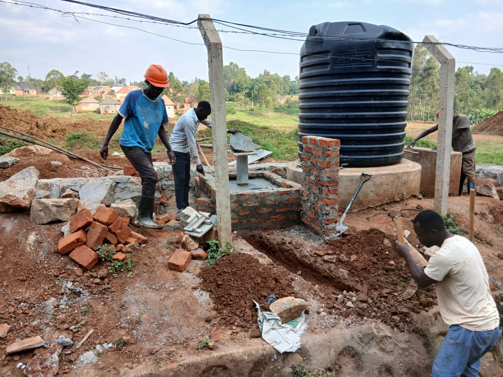 Burlcore water well construction in Mawero, Busia: Installing the elevated storage tank